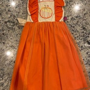 Boutique pumpkin dress! New with tags! Never worn! Size 6-7